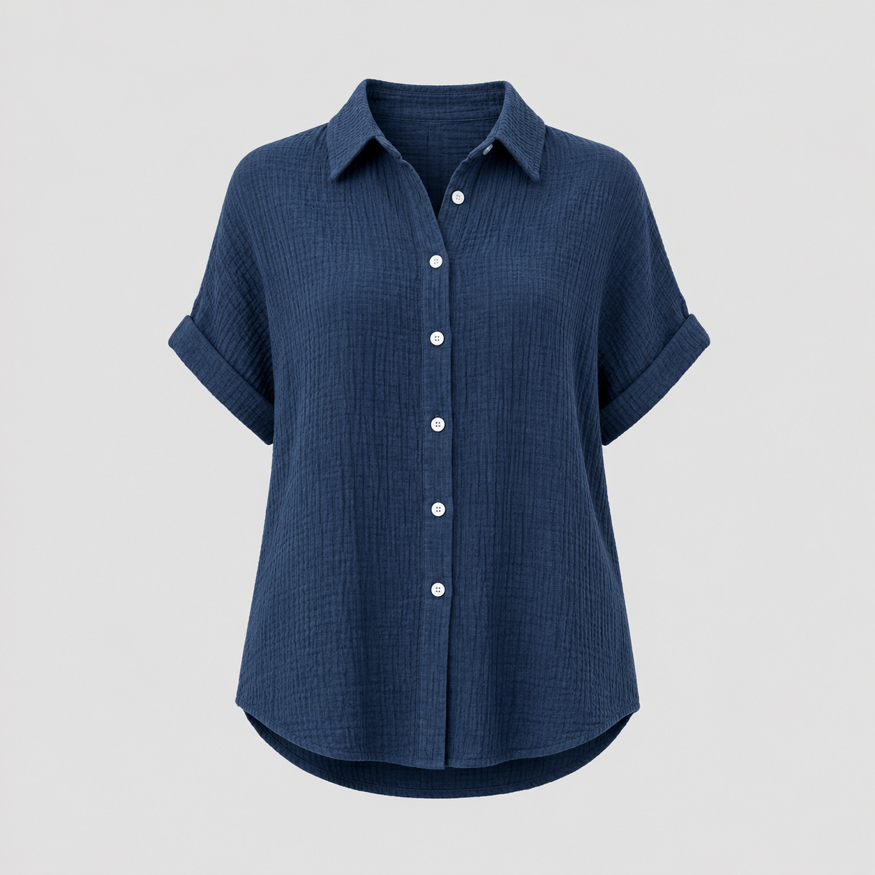 Textured button-up shirt with collared neckline, rolled short sleeves, and relaxed oversized fit