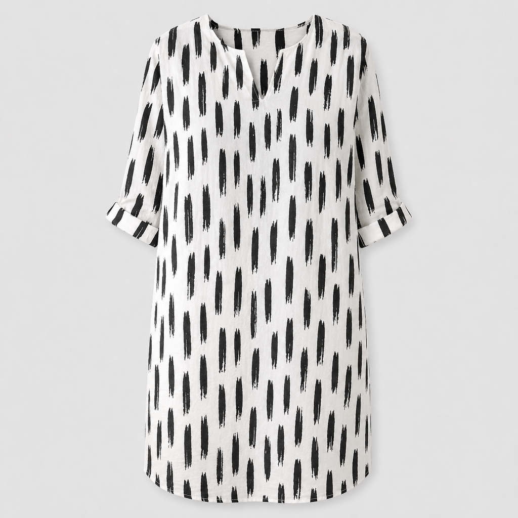 White dress with black abstract print and rolled sleeves