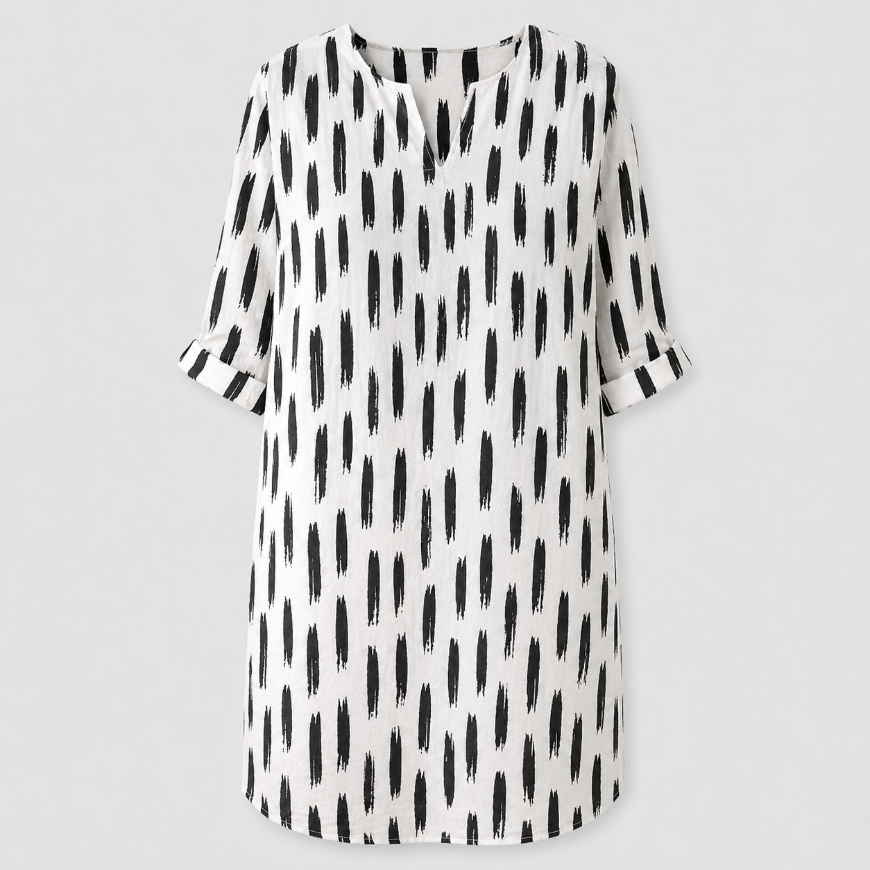 White dress with black abstract print and rolled sleeves