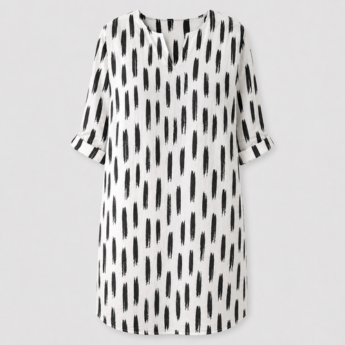 White dress with black abstract print and rolled sleeves