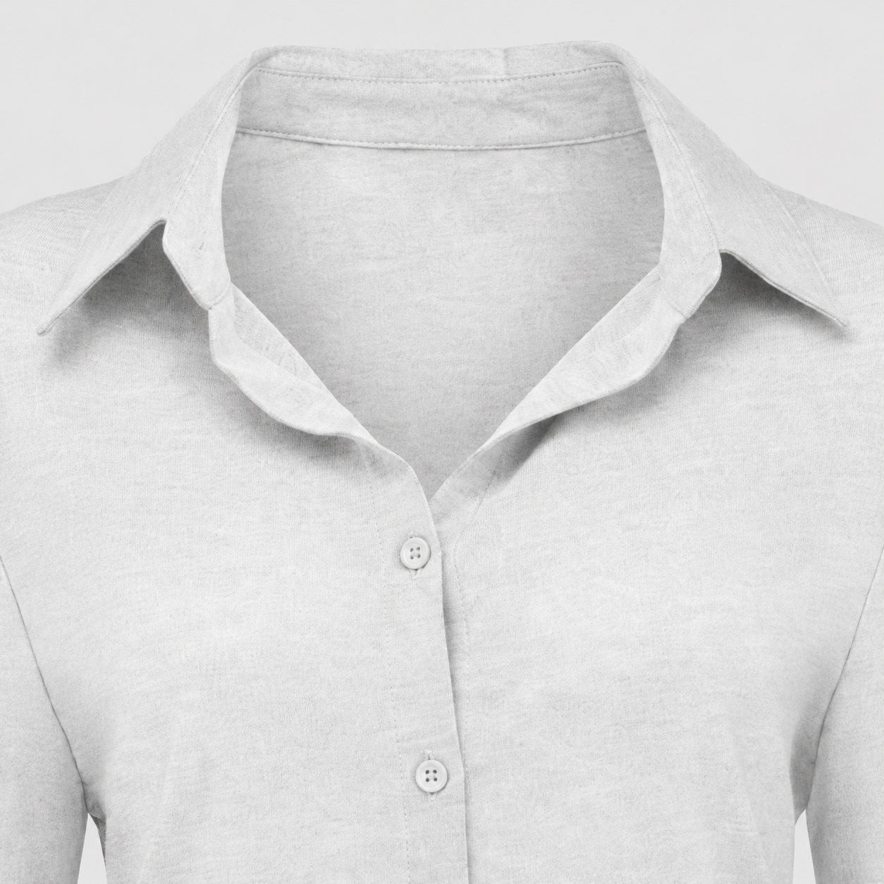 Long sleeve button-up shirt with collared neckline, tailored fit, and curved hem