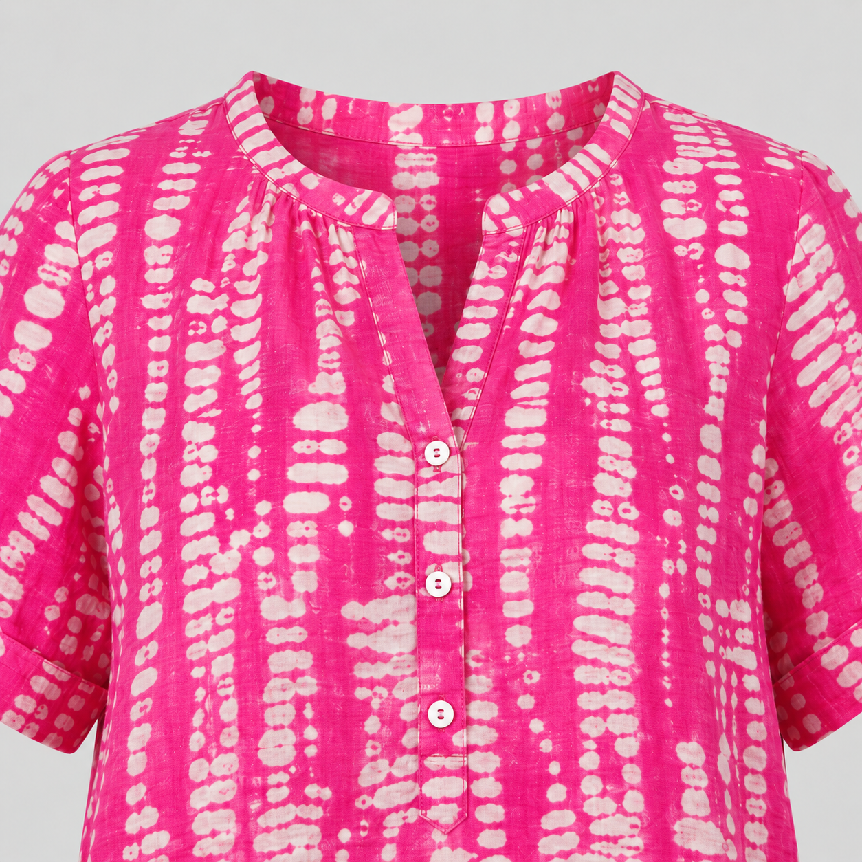 Abstract print blouse with split V-neck, short rolled sleeves, and relaxed silhouette