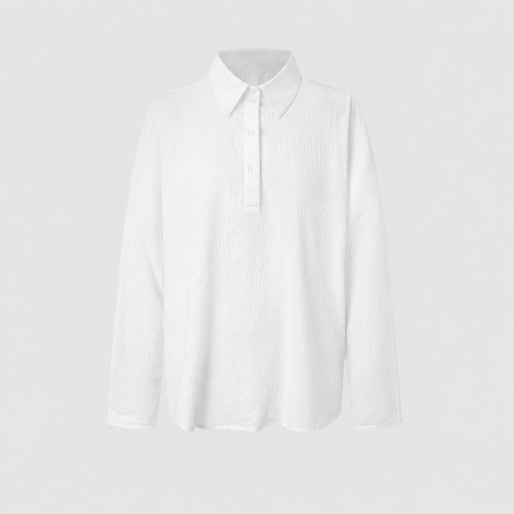 Long sleeve oversized polo shirt with pointed collar, partial button placket, and relaxed silhouette